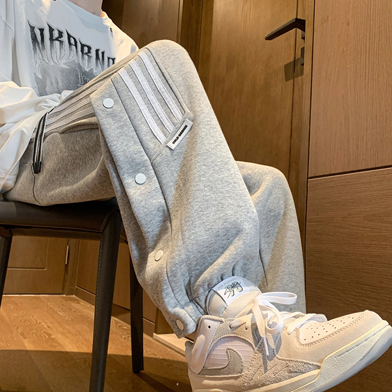 裤子男款春秋设计感排扣束脚卫裤潮牌高街青少年大码运动休闲长裤