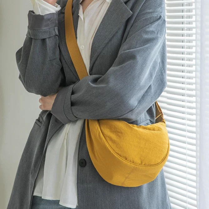 U家尼龙帆布包包女2024春新款潮夏时尚马鞍包ins百搭斜挎包饺子包