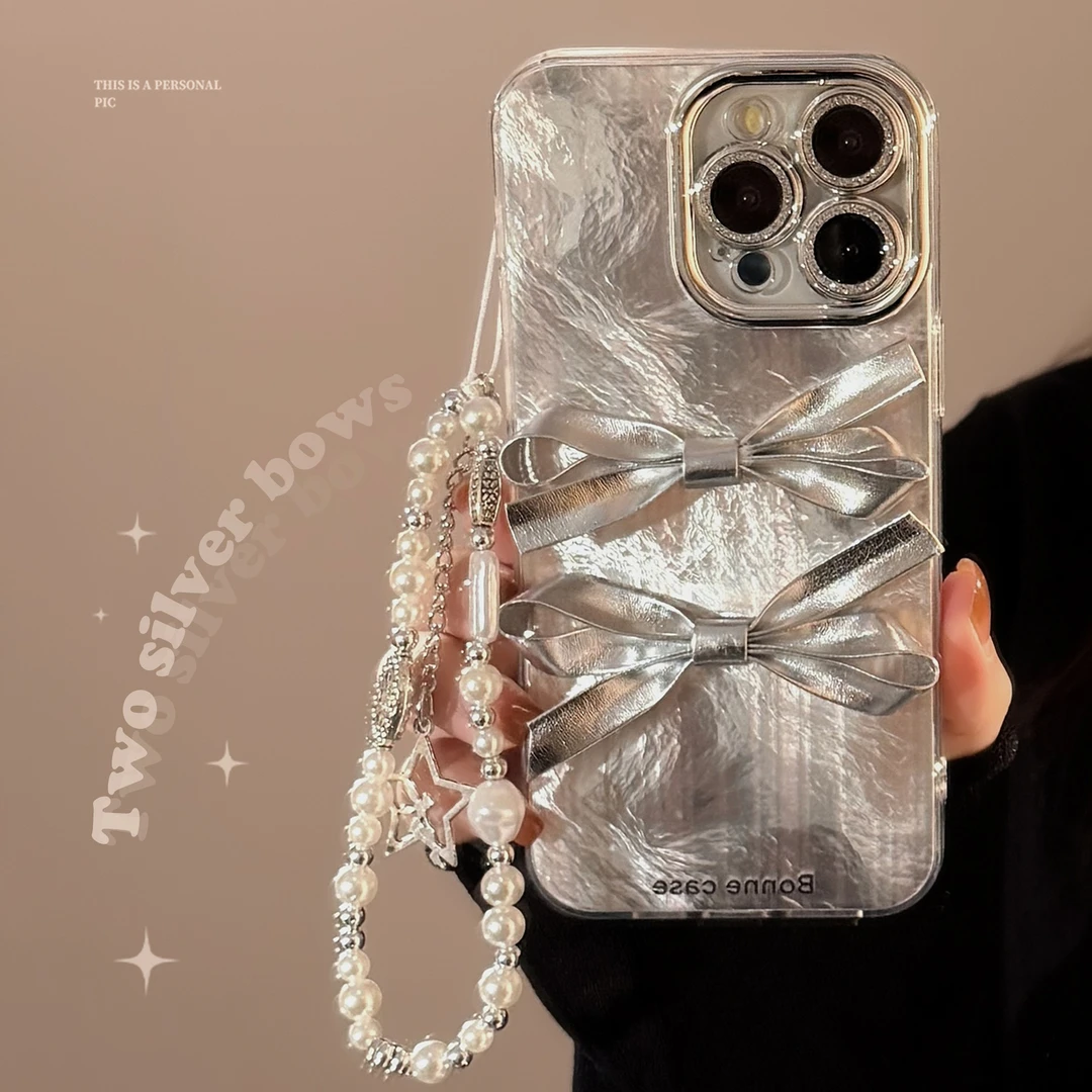 立体银色蝴蝶结手机壳适用16苹果15promax轻奢iphone14带挂绳全包