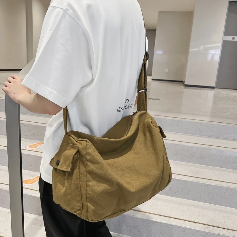 大容量复古帆布斜挎包男背包日系休闲邮差包学生单肩包旅行通勤包