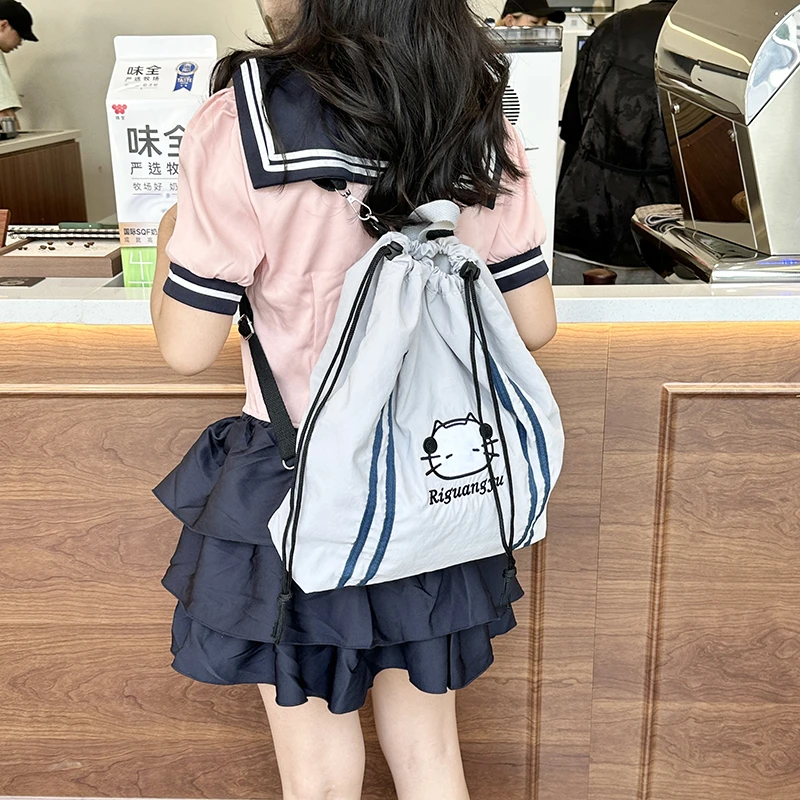 可爱耳机猫抽绳薄袋双肩包2024新款慵懒风学生上课背包百搭单肩包