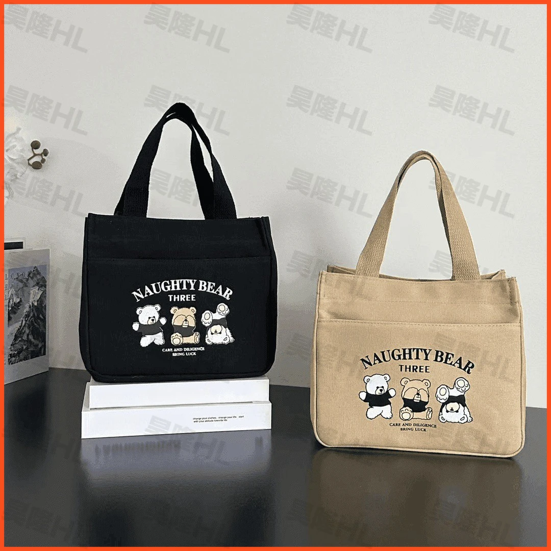 拉链外侧兜帆布手提包多口袋手拎包学生便携饭盒包通勤女包零食包