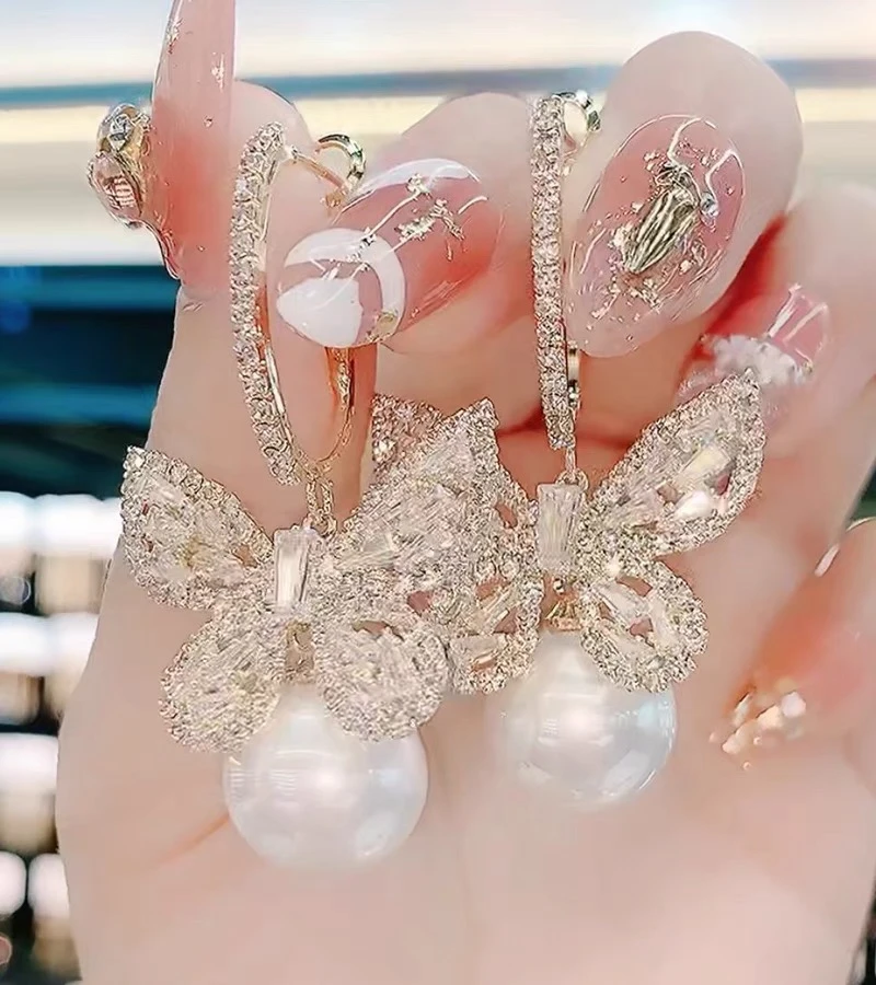 铜合金合成锆石耳饰 4396时尚气质微镶密锆蝴蝶珠珠耳环￼