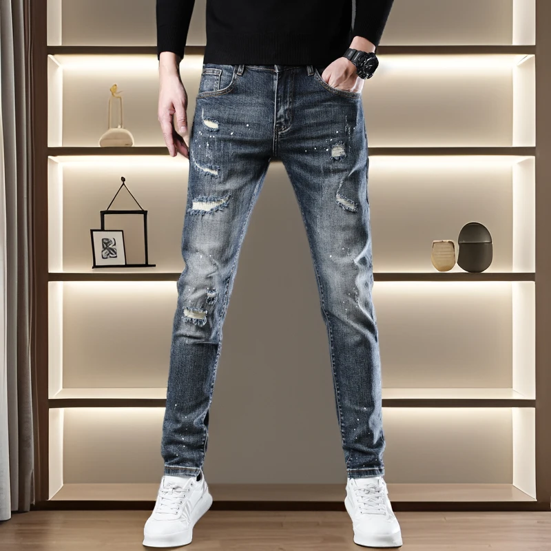 秋冬新款高端潮品男士牛仔裤时尚个性泼墨假破洞弹力修身小脚长裤