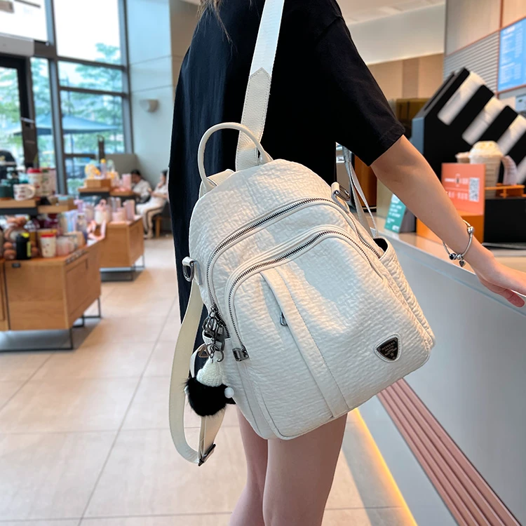 2025新款春夏白色软皮双肩包女多口袋休闲旅游背包时尚百搭单肩包