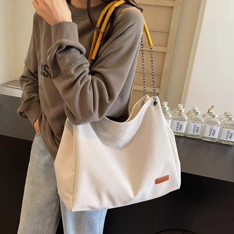 大容量雅丹女2024新款休闲百搭通勤托特包简约帆布包链条单肩包潮