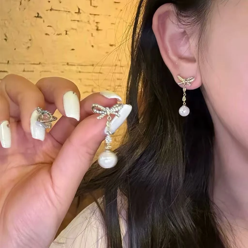 铜合金仿珍珠耳饰 870时尚潮流蝴蝶结米珠蝴蝶结长款耳环