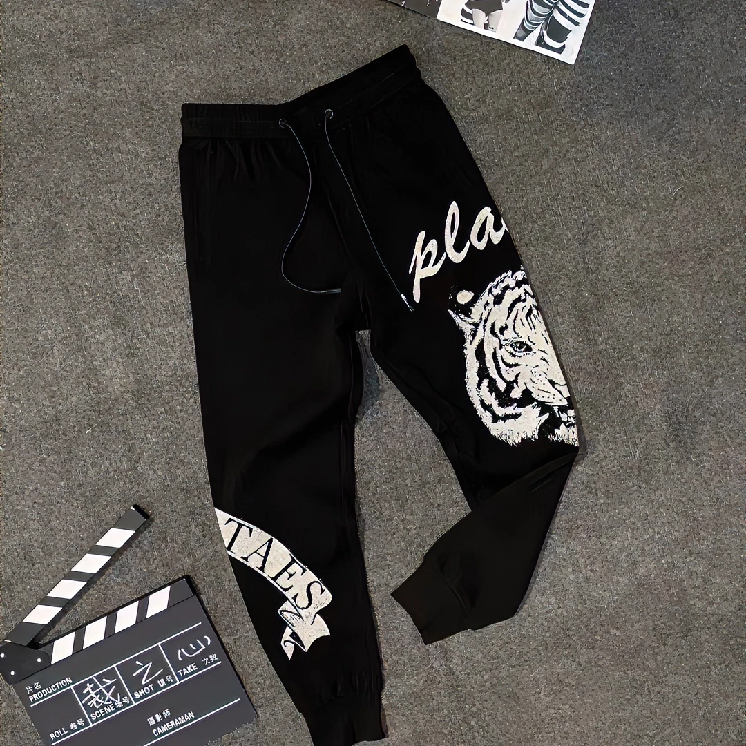 秋冬加厚潮牌卫裤修身卫裤男士时尚百搭个性休闲裤老虎烫钻