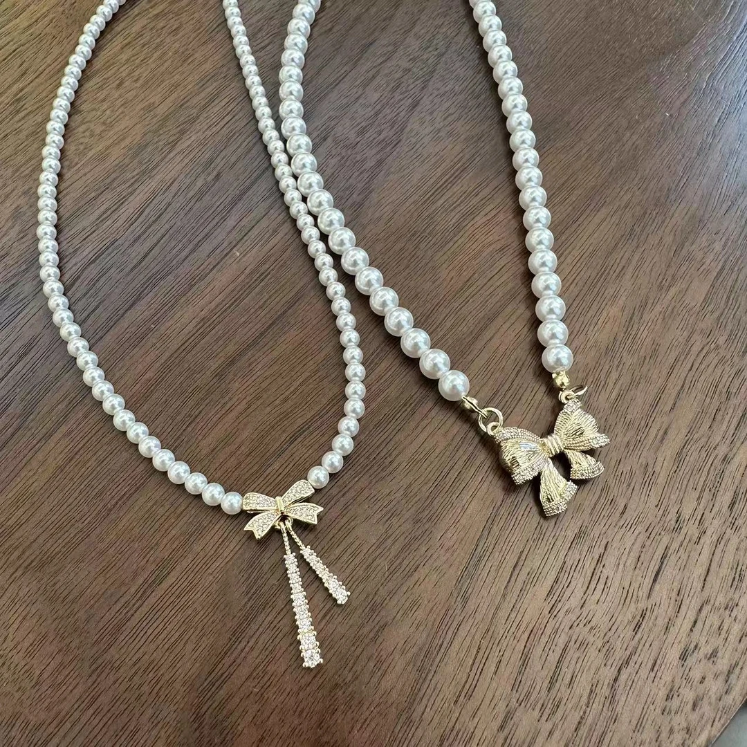 铜合金仿珍珠吊坠 SP24114   蝴蝶结吊坠闪钻珠珠项链