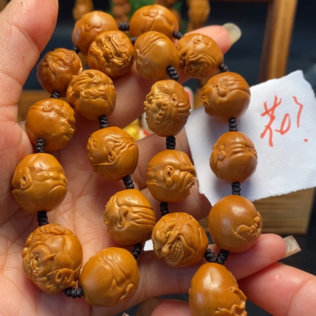 橄榄核核雕恶僧手持，花了