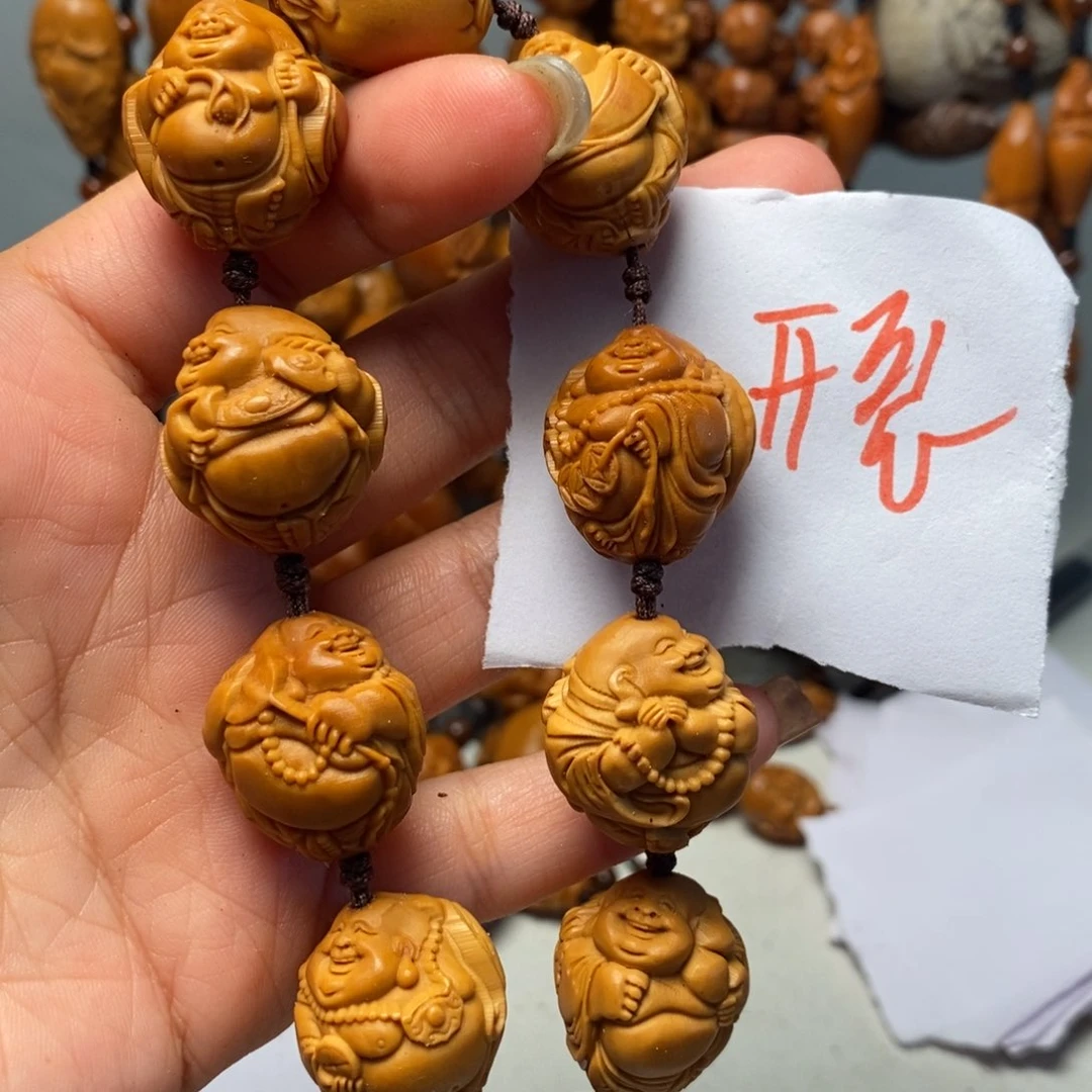 橄榄核核雕瑞兽弥勒，开裂