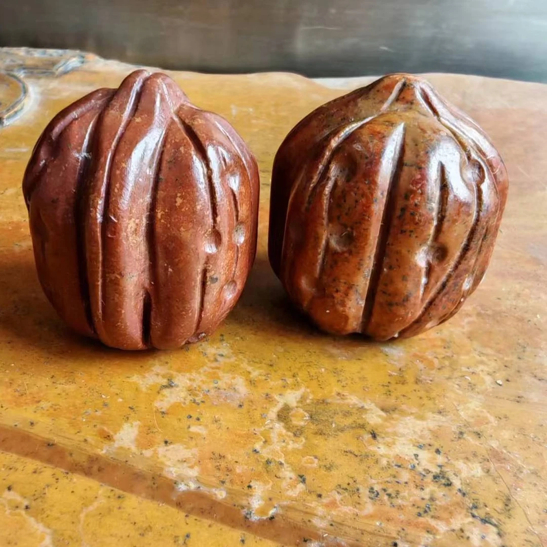 泗水砭石核桃手把件