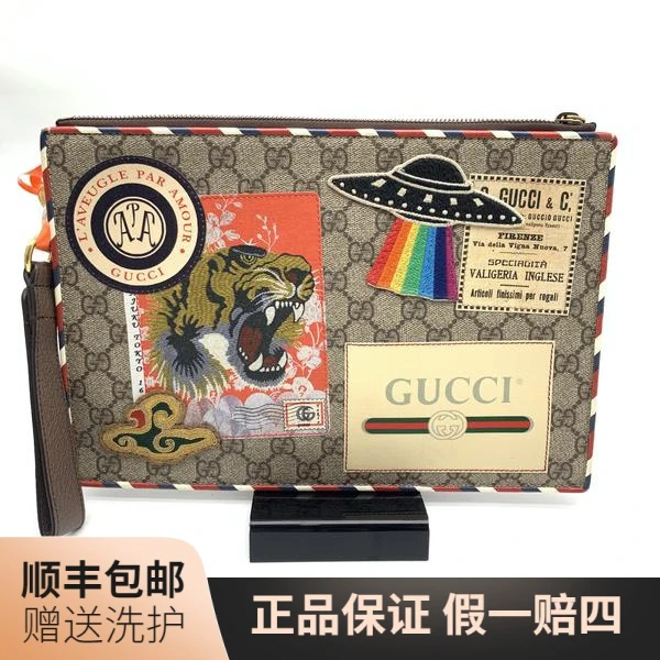 95新 GUCCI/古驰 古驰老花徽章款手拿包/10014604经典奢侈棕色
