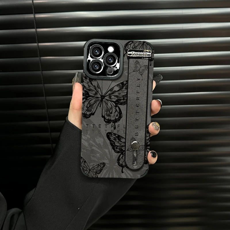 适用苹果13/14/15promax手机壳复古蝴蝶瞳眼翻毛皮腕带保护套