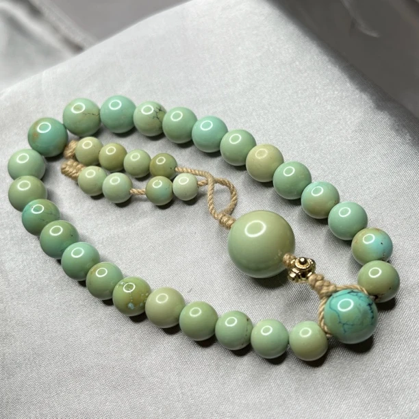 绿松菜籽黄圆珠手持，尺寸7.6～10.2mm重32.22克