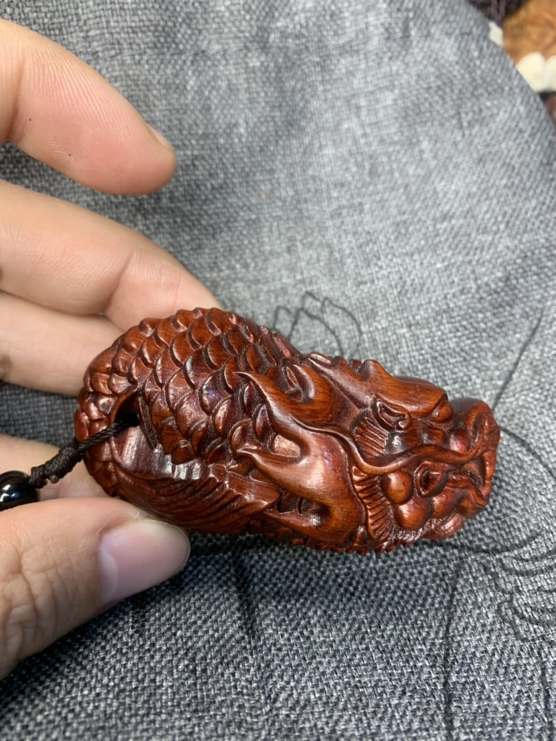 鱼化龙手把件红木雕