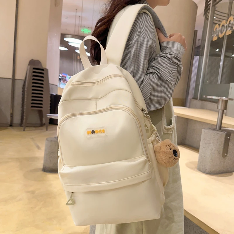 简约纯色双肩包女高颜值休闲轻便旅行包小学生初中高中生书包男孩