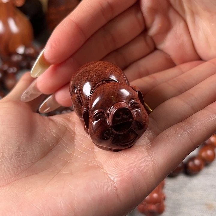 黄花梨小猪手把件