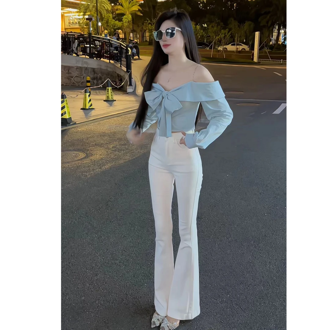 2024秋性感辣妹一字肩链条蝴蝶结绑带上衣气质百搭高腰牛仔喇叭裤