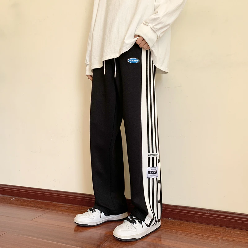 春款休闲直筒排扣开叉裤子男士宽松百搭运动长裤青少年男生阔腿裤