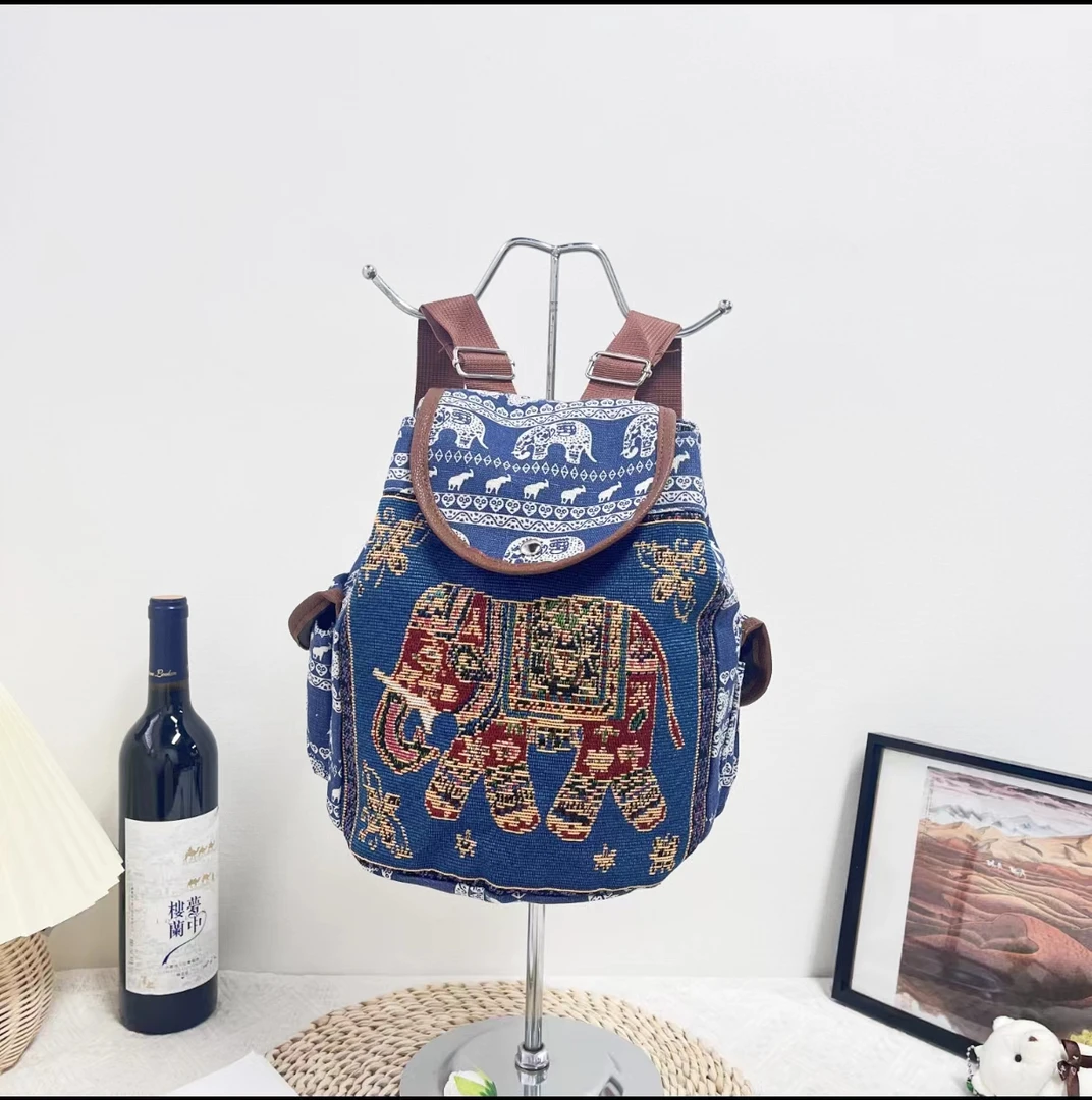 新款民族风刺绣提花帆布女双肩包学院风大容量束口扣盖抽绳背包