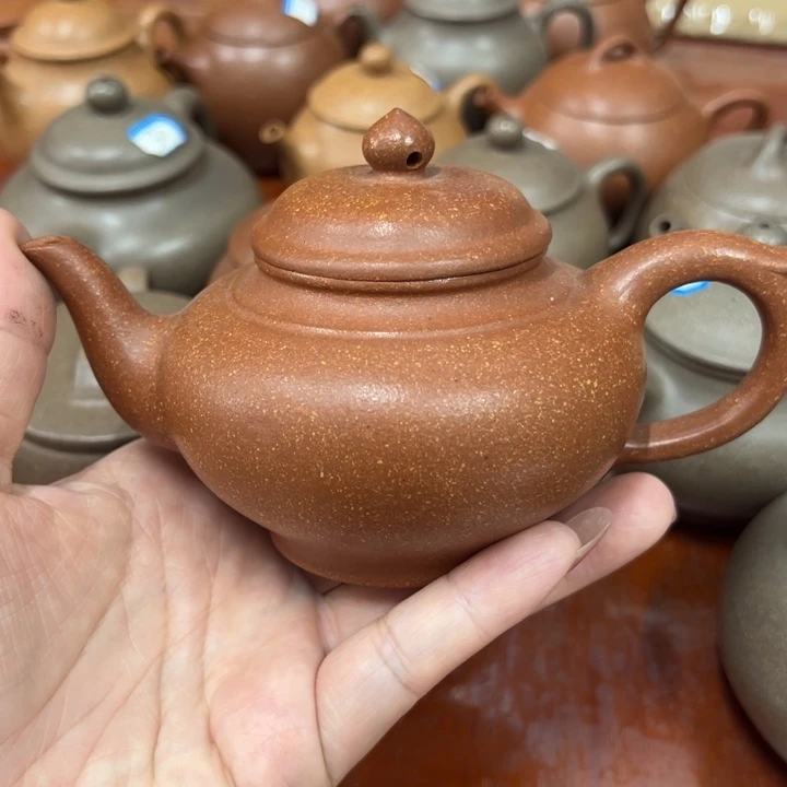 紫砂茶壶健**。瑕疵笑樱