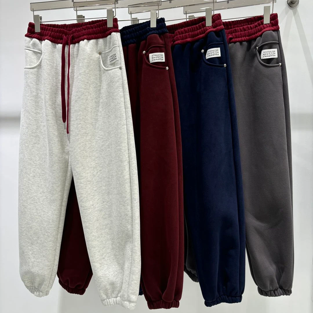 女装撞色铆钉装饰标加绒卫裤