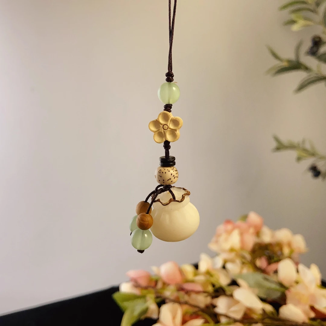 白菩提招财福袋手机包包挂约19*19mm