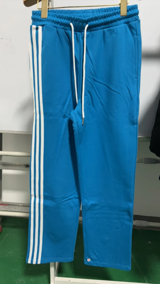 JC女士蓝色直筒针织卫裤侧条拼白条局部微瑕