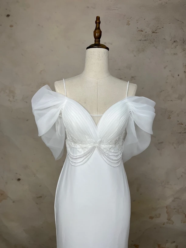 一字肩白色晚礼服2024新款法式轻奢小众高端订婚鱼尾裙高级感