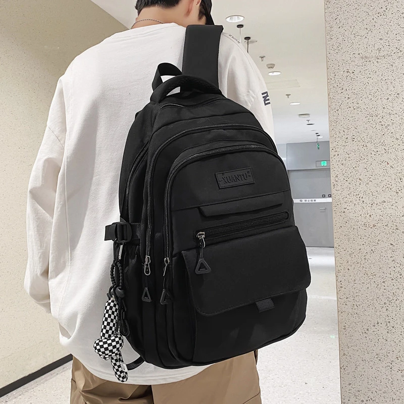 大容量书包高中学生时尚男生黑色大学生男款电脑双肩背包女ins