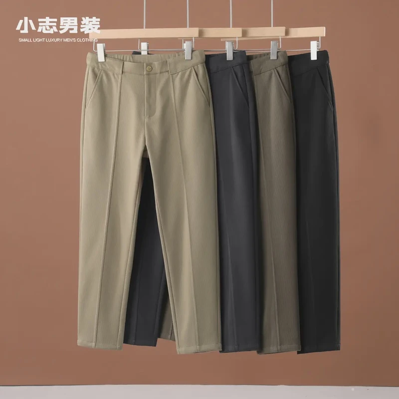 潮流男士冬季松紧腰毛呢料休闲裤复古纯色百搭立体裁剪锥形长裤子