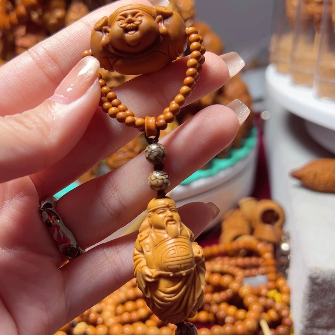 橄榄核核雕我***呢财神指捻