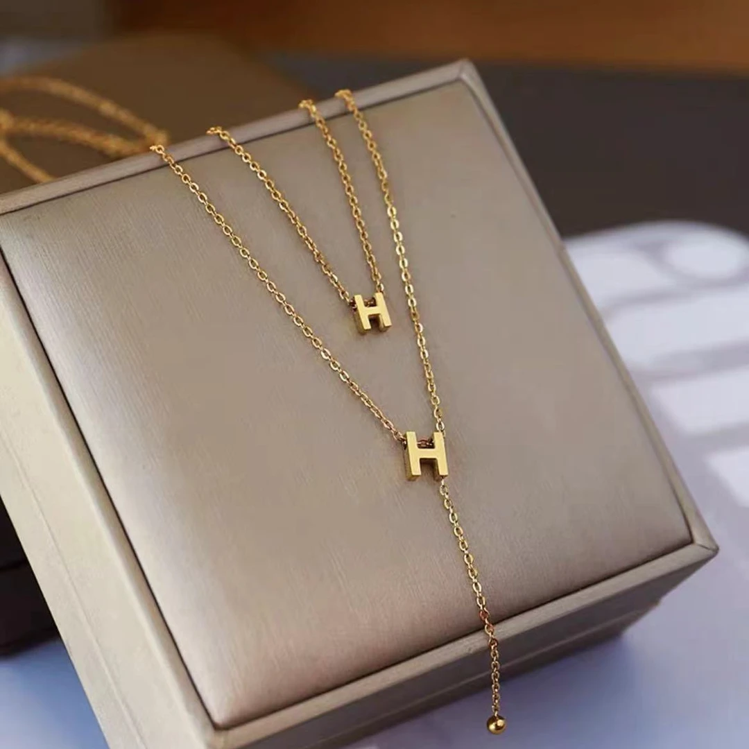 钛钢项链 （蒂）AA-757钛钢春夏灵动双H流苏米珠锁骨项链