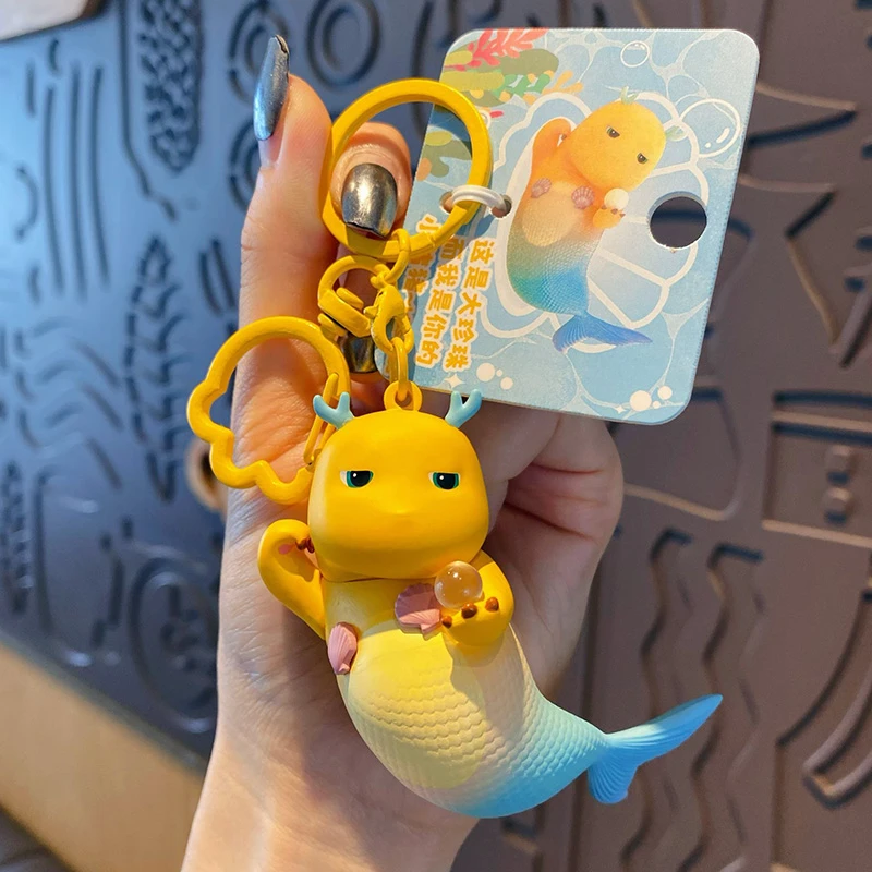 2024年新款美龙鱼假日奶龙钥匙扣女生情侣可爱钥匙链男款书包挂件