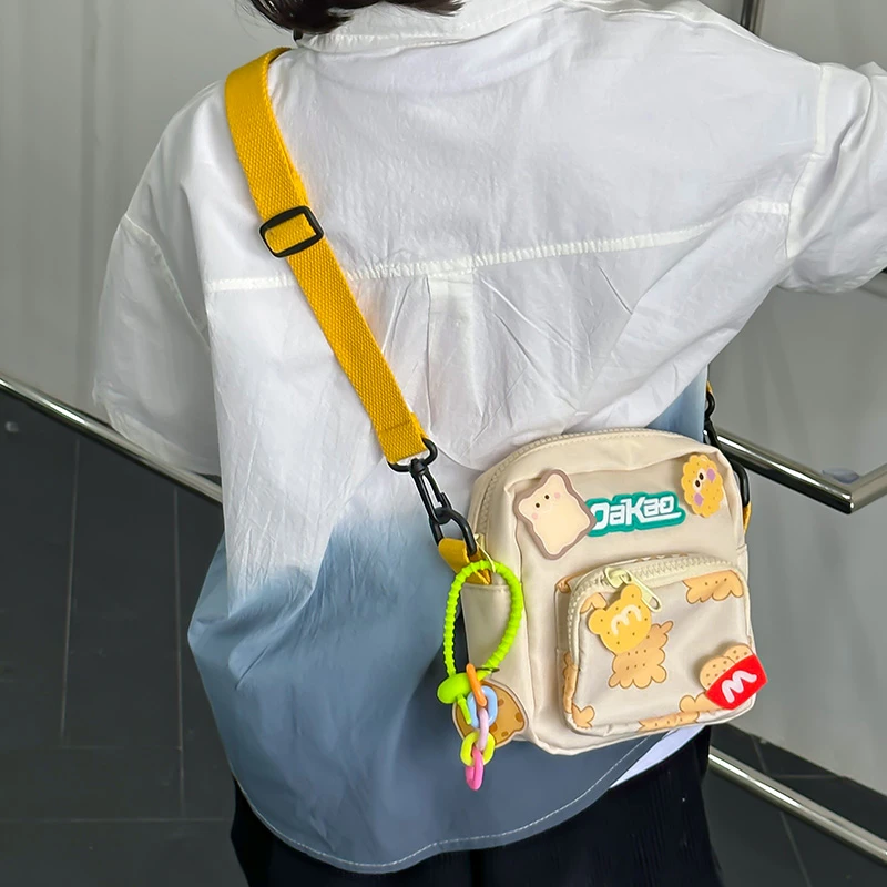 儿童斜挎包2024新款卡通饼干挎包男女宝宝洋气外出单肩网红小背包
