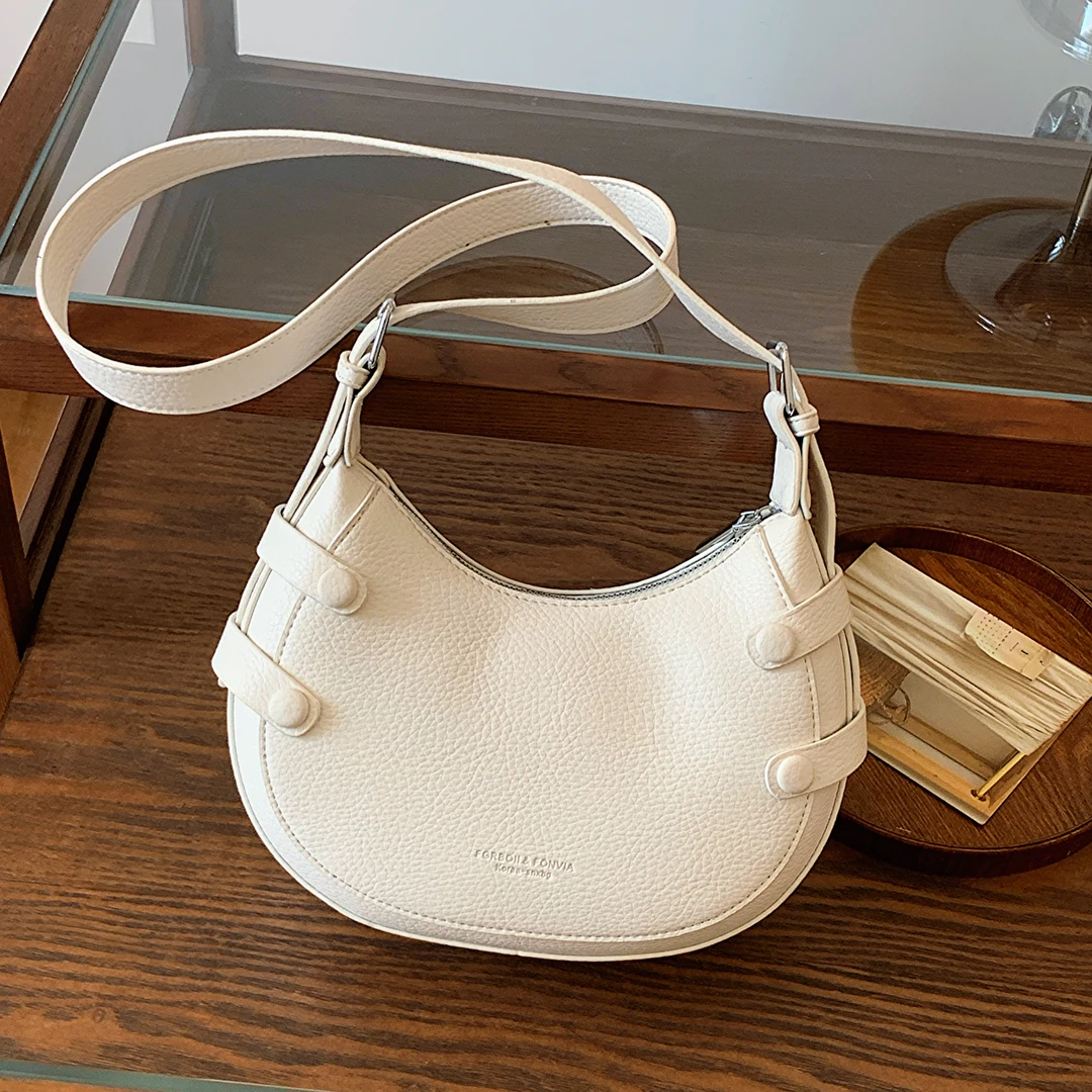 小众百搭单肩时尚韩版饺子包百搭夏季简约斜挎包腋下法棍包白色小