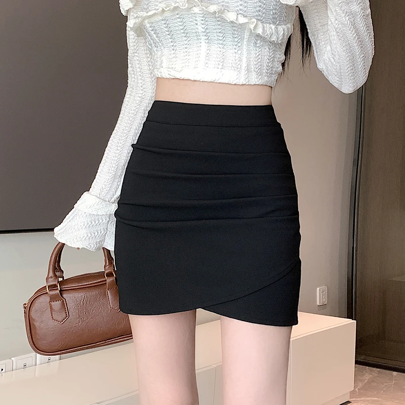 黑色包臀半身裙女秋季2025新款高腰显瘦A字不规则褶皱辣妹短裙