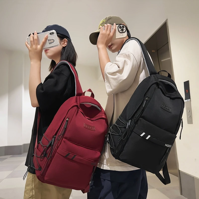 儿童书包女生小学生初中生高中男生字母旅游轻便背包大学生双肩包