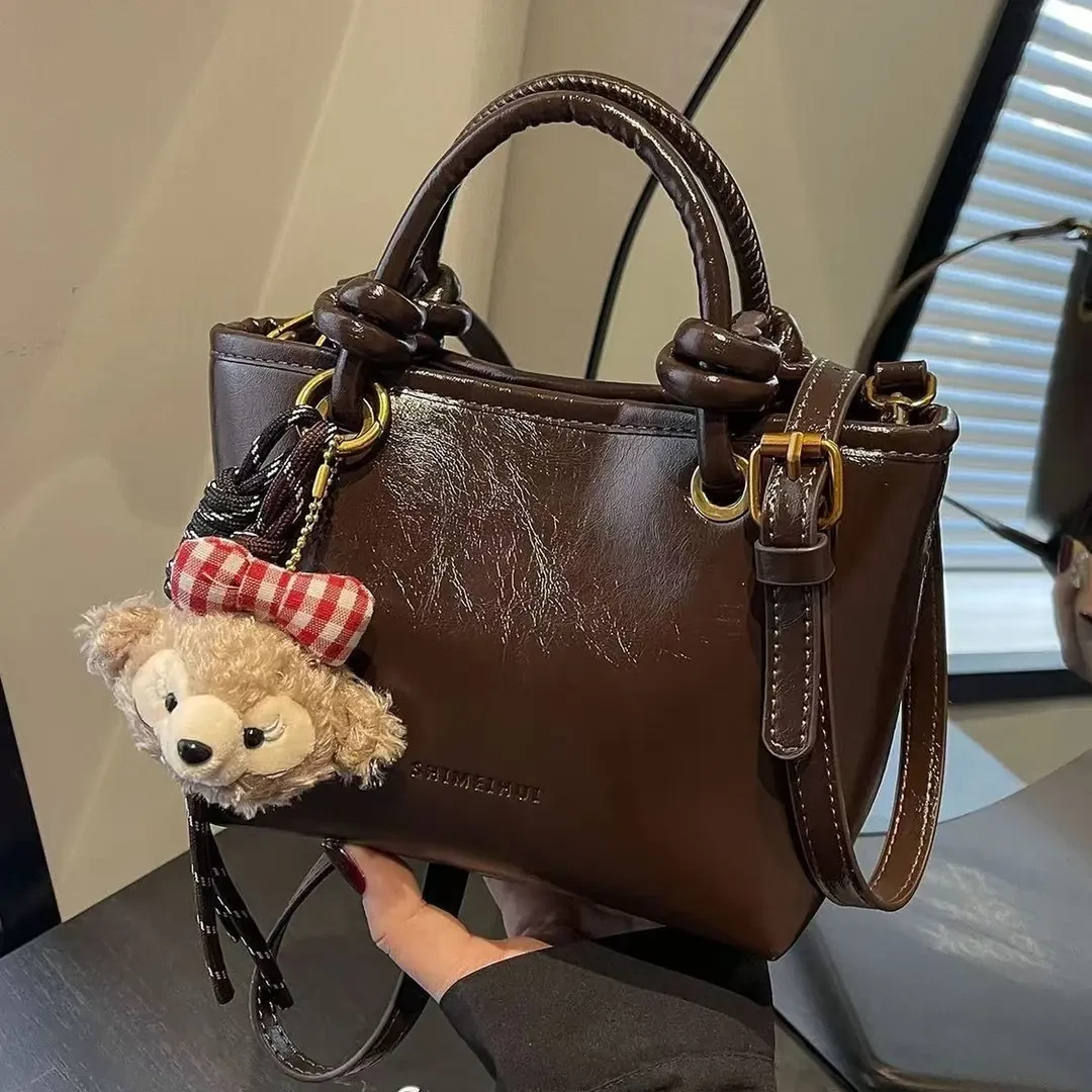 高级感复古棕色小包包女2026新款秋冬季百搭斜挎包手提水桶包F313