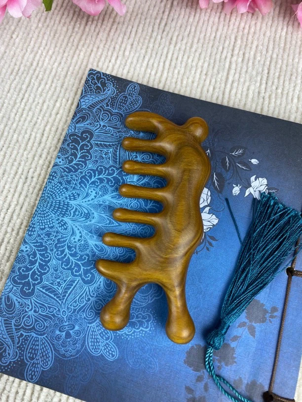 正宗绿檀木大蜗牛按摩梳