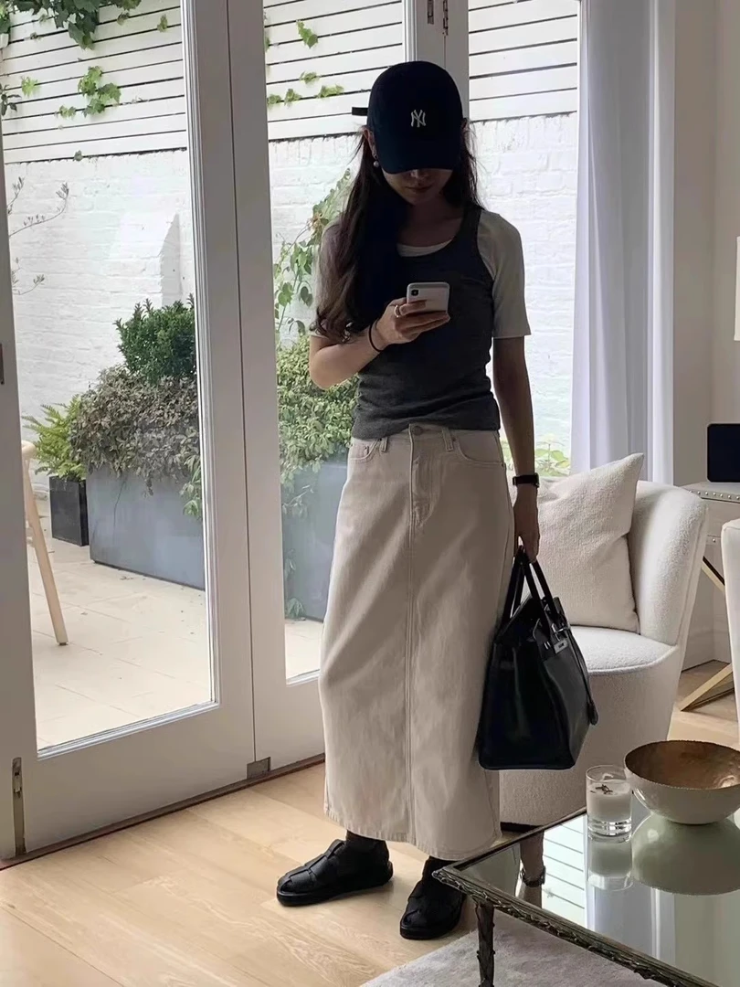 现货 ounce 韩国东大门代购2024秋新款 纯色高腰显瘦后开叉半身裙