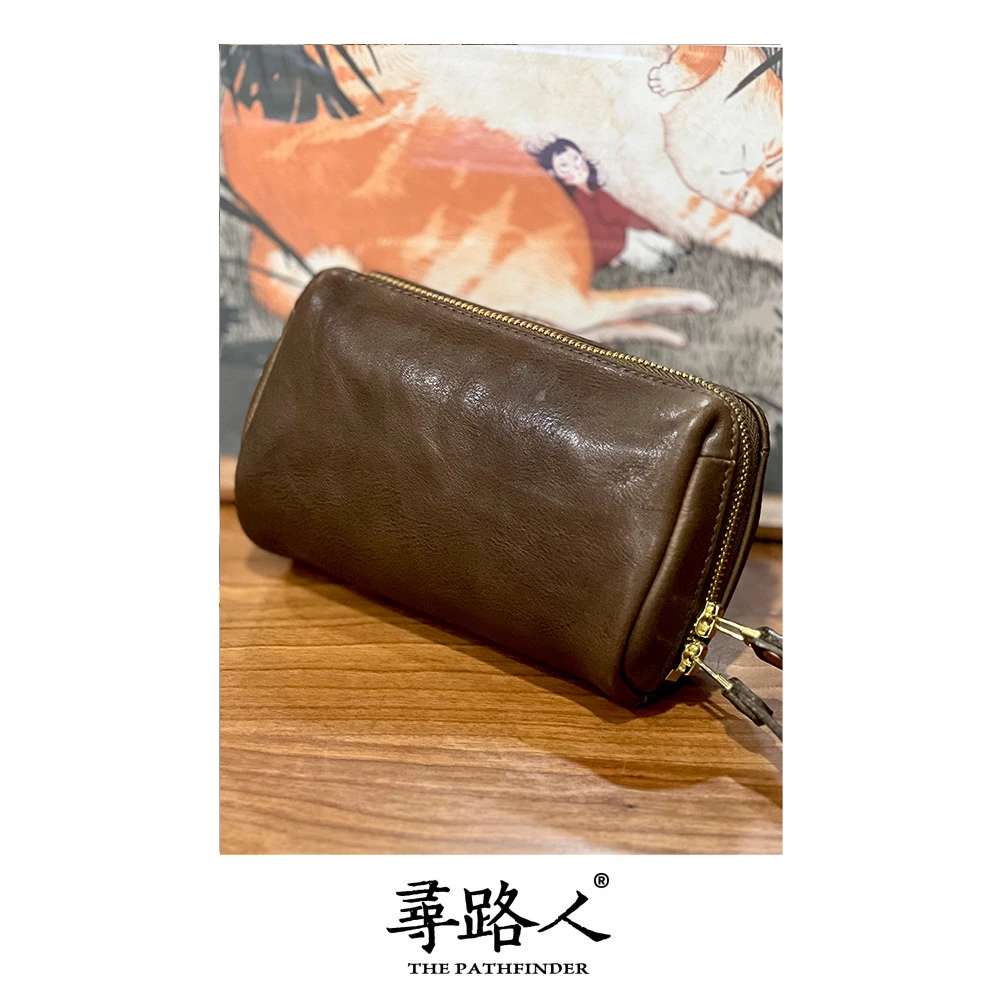 寻路人质感休闲女士真皮简约大气便携个性手拿包包