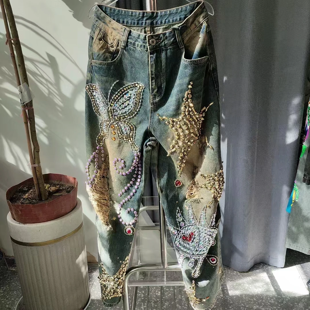 82035 时尚休闲破洞印花重工提花印花小脚破洞百搭裤子