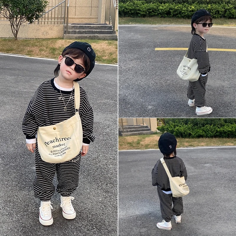 儿童包包洋气潮酷男女童宝宝斜挎包幼儿园小男孩大容量单肩帆布包