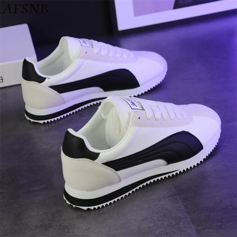 啄木鸟正品新款男女鞋潮皮面平底经典阿甘低帮白鞋女士德训鞋鞋子