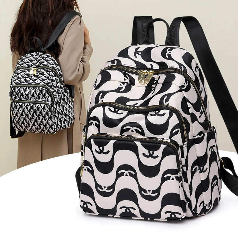 大容量双肩包女印花旅行小背包书包2024新款时尚潮流尼龙牛津布包