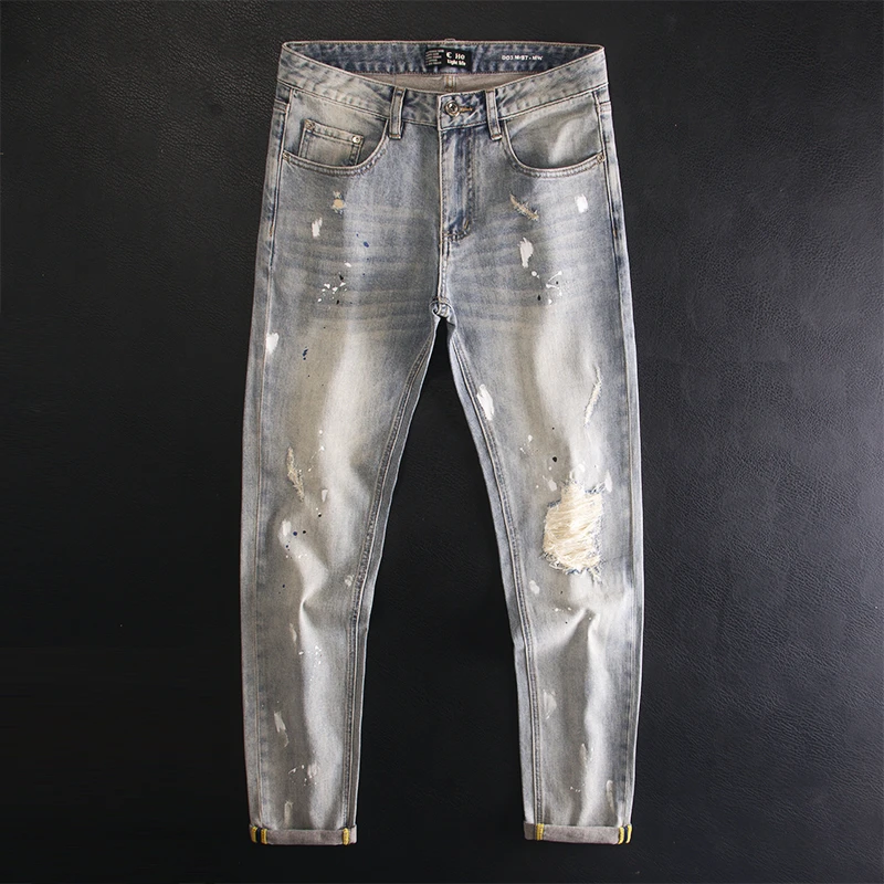 高端破洞补丁牛仔裤男修身小脚弹力喷漆复古做旧水洗设计潮流长裤