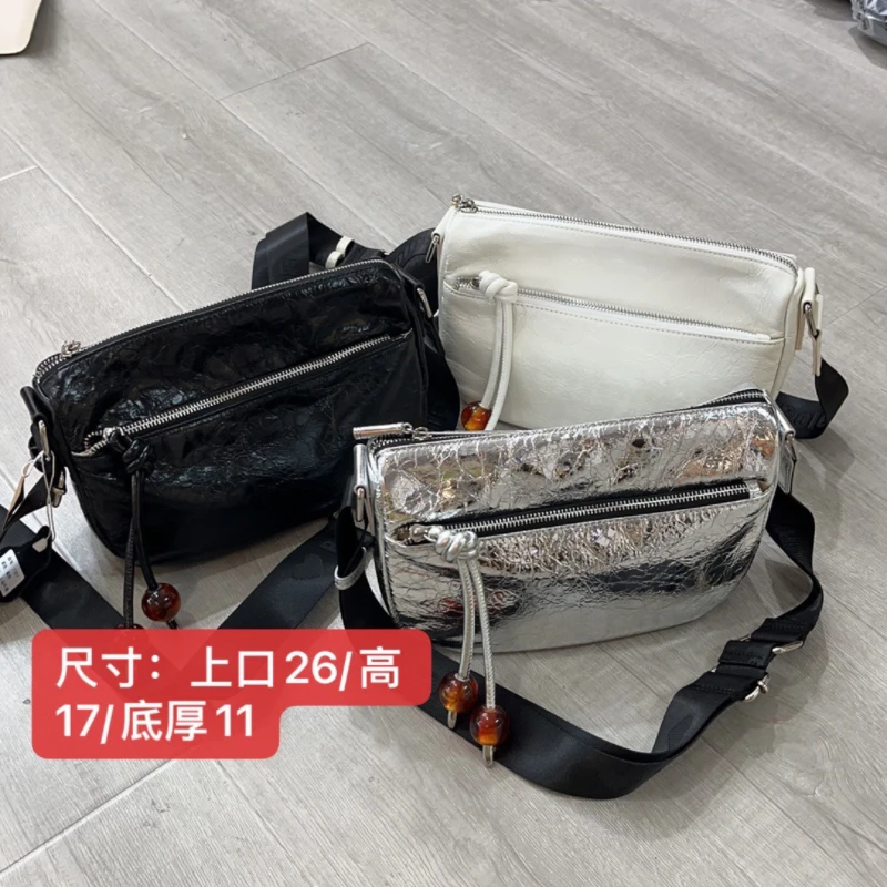 7187牛皮多隔层斜挎休闲女包百搭时尚