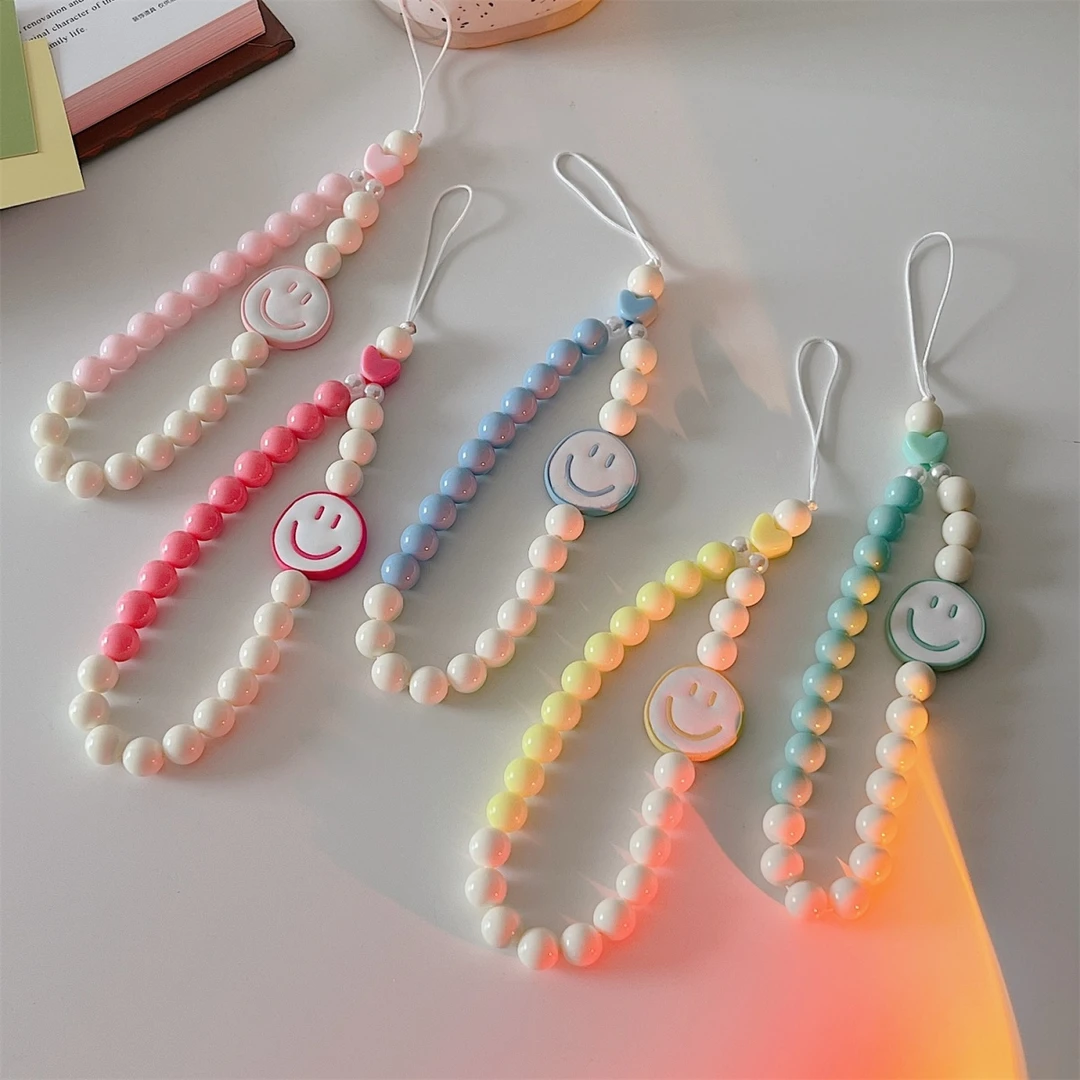 适用日韩彩色笑脸手机手链ins手腕带防丢手环挂件防摔挂饰可爱挂